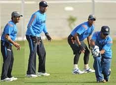 L-R: Sachin Tendulkar, VVS Laxman and Rahul Dravid watch as teammate Mahendra Singh Dhoni takes a catch during a training session ahead of the third and final cricket Test match against Sri Lanka, in Mumbai.PTI