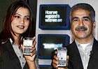 Nokia India Director-Marketing Vineet Taneja (right) with a model at the launch of the new Nokia E-72 in New Delhi. PTI