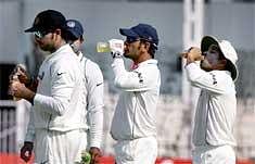 India captain M S Dhoni along with fellow teammates Yuvraj Singh and Sachin Tendulkar during drinks break at Brabourne Stadium Wednesday. AP