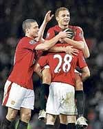 Manchester United players celebrate Darron Gibsons goal in their 2-0 win over Tottenham Hotspur in the Carling Cup quarterfinal on Tuesday. AFP