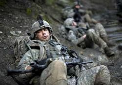 Marathon war: American soldiers on a break from patrolling the Korengal Valley in Afghanistan. NYT