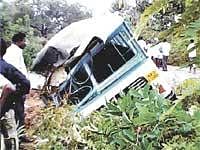 A BMTC bus fell into a drain on Mysore Road near Bidadi on Thursday. KPN