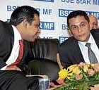 marching ahead: BSE MD & CEO Madhu Kannan (left) with Sebi Chairman C B Bhave during the launch of BSE StAR MF - Mutual Fund trading platform in Mumbai on Friday. Pti