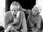 victims for life Eighty-year-old Rampyari Bai (R) and her sick son Bhawarlal, both affected by poison gas, sit in front of her home in a slum area near the Union Carbide  pesticide plant in Bhopal on Dec 2. Reuters