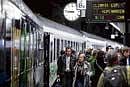 People walk on the platform as they arrive to board the Climate Express train at Brussels South station on Saturday. AP