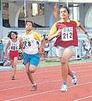 The Brigade Schools Jaya Nanthini J (right) en route to winning the 100M gold in the girls under-12 category at the Deccan Athletic Club meet on Sunday. DH Photo