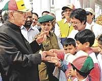 for a cause: Governor H R Bhardwaj interacting with children at World Autism Awareness walkathon, organised by Information and Resource Centre in Bangalore on Sunday.  dh Photo