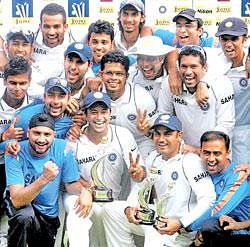 Team India poses for photos after the third Test against Sri Lankans and reaching the first spot in Mumbai on Sunday. PTI