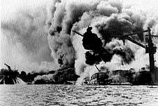 In this December 7, 1941, file photo, the USS Arizona goes up in flames after the Japanese attack on Pearl Harbor in Hawaii. AP