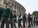 School children visit the Parliament, in New Delhi on Monday. PTI