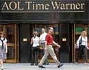 Pedestrians pass by the AOL Time Warner headquarters in New York's Rockefeller. AP