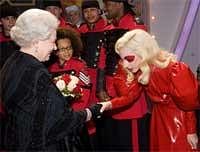 Britain's Queen Elizabeth II (L) meets American singer Lady Gaga (R) following the Royal Variety Performance in Blackpool, England on Monday. AFP