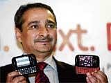 Samsung Director (Mobiles & IT) Ranjit Yadav posing with the new Corby phones at the launch in Kolkata on Wednesday. AP