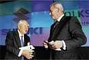 Volkswagen CEO Martin Winterkorn (right) with Suzuki Motor Chairman & CEO Osamu Suzuki in Tokyo on Wednesday. AP