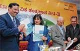 Ashok Kumar C Manoli (left) & BioTech Vision Group  Chairperson Kiran Mazumdar Shaw at the launch of the new policy in Bangalore on Wednesday. DH Photo