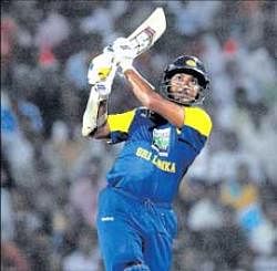 Sri Lankan skipper Kumar Sangakkara takes the aerial route during his blistering 78 in the first T20 international against India in Nagpur on Wednesday. AFP