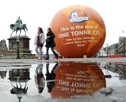 A balloon is seen with ''This is the size of one tonne CO2'' written on it near the City Hall of Copenhagen on Wednesday. AFP