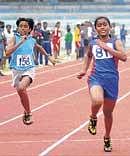 S Pranitha Pradeep (right) en route to the girls 100M gold at the Star Track Athletic Clubs State-level meet. dh photo