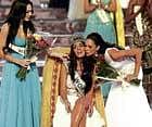 on cloud nine: Gibraltar's Kaiane Aldorino is congratulated by second placed South African Tatum Keshwar, right, after  winning the Miss World pageant in Johannesburg, South Africa, on Saturday. AP