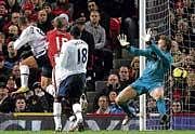 Bang on! Aston Villa's Gabriel Agbonlaho (extreme left) heads the ball past Manchester United goalkeeper Tomasz Kuszczak during the English Premier League tie on Saturday. AP