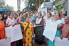 Women protesting against assault on a woman near Kulashekar church on Monday. DH photo
