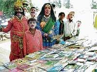 Camouflaged: Artistes dressed in attires during district-level Yuvajanotsava held in Chikkaballapur on Monday. DH Photo