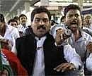 Supporters shout slogans as police arrest Congress MP L Rajagopal in Hyderabad on Monday. AP