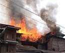 A house is seen that was allegedly set on fire by teargas shells fired by security personnel in Srinagar on Tuesday. AP