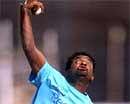 Sri Lankan cricketer Muttiah Muralitharan bowls during a practice session in Rajkot on Monday. AFP