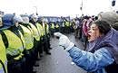 The heat is on: A protester shouts at police officers blocking a road during a demonstration outside the United Nations Climate Change Conference 2009 in Copenhagen on Wednesday. REUTERS