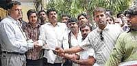 Hear Our Demand: The members of the district Youth Congress submitting a memorandum to Additional Deputy Commissioner S N Gangadhariah seeking expulsion of Reddy brothers from State cabinet. B V Anand Kumar, Tyagaraj, Akbar, Javed, Rajesh Singh and Praveen Kumar are seem. DH photo
