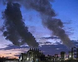 Smoke billows from the chimneys of a wood products factory near the city of Burgos, northern Spain. File photo/ Reuters