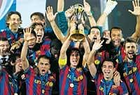 Victorious: Barcelona players display the spoils after winning the Club World Cup on Saturday. AFP