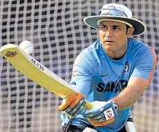 Eyes on the ball: Stand-in skipper Virender Sehwag in experimental mode during Sundays practice session at the Barabati stadium in Cuttack. AP