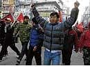 Maoist supporters shout slogans against the government as they march during their three-day strike in Katmandu on Sunday. AP