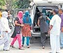 Police rescue bar girls near Bagalur bus station in Bangalore on Sunday. DH photo