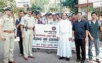 The awareness rally organised as part of the Crime Prevention Month programme in Mangalore on Monday. dh photo