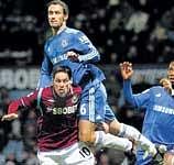 Keen tussle: Chelseas Ricardo Carvalho (right) vies for the ball with West Ham Uniteds Guillermo Franco during their English Premier League match on Sunday. AP