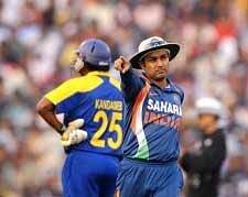 Stand-in captain Virender Sehwag leads his team during the third ODI in Cuttack. AFP