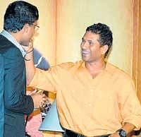 Sweet moment: Sachin Tendulkar (right) offers a sweet to Sourav Ganguly at a function in Kolkata on Tuesday. AP