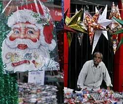 A roadside vendor selling Christmas souvenirs wait for buyers in Bangalore. AP
