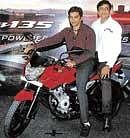 Bajaj Auto General Manager (Two-Wheeler) Milind Bade (right) & F1 driver Narain Karthikeyan in Bangalore.