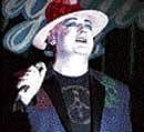 Singer Boy George performs onstage in a club in central London on Tuesday. AP