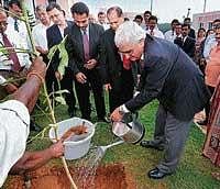 Union Minister of State for Corporate Affairs and Minority Affairs Salman Khurshid pouring water to a plant in the premises of TAPMI in Manipal on Wednesday. dh photo