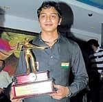 Great finish: Mumbais Aditya Mehta poses with the trophy after his win over Sourav Kothari in Chennai on Thursday.