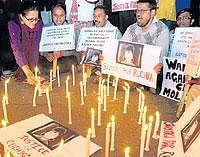 People take part in a candle light procession demanding justice for Ruchika in New Delhi. PTI