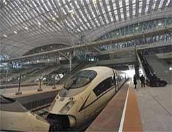 In this photo distributed by the Xinhua news agency, a high-speed train is seen at the Wuhan Railway Station in Wuhan, central China. China opened the Wuhan-Guangzhou railway, its longest high-speed railway on Saturday. AP