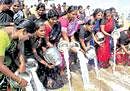 A group of women pouring milk in the sea at Marina beach in the memory of tsunami victims in Chennai on Saturday. PTI