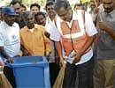 Law Minister Suresh Kumar leading by example during the 'Keep City Clean - Keep Diseases Away'  awareness programme in Rajaji Nagar on Saturday. DH PHOTO