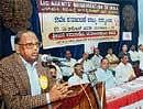 MP and the President of the LICAOI Basudev Acharia speaking at the second state conference in Mangalore on Sunday. DH photo